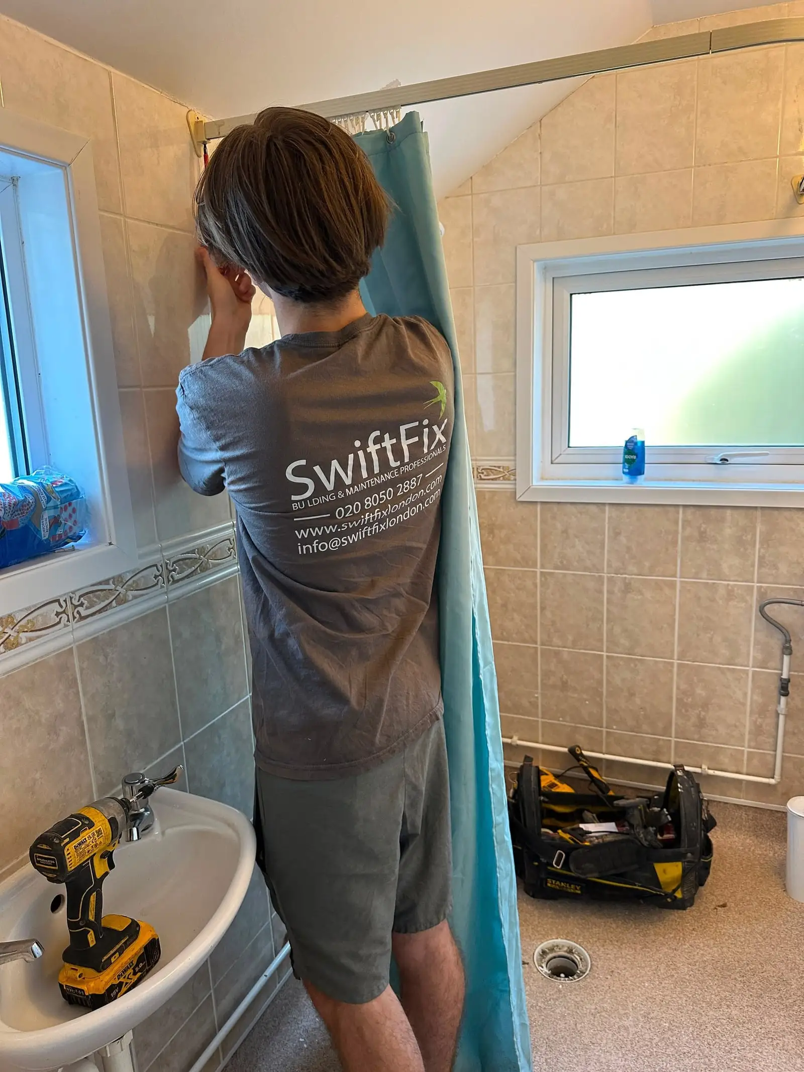 Old bathroom being stripped out by Swift Fix