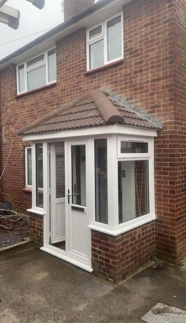 Brick porch with tiled canopy
