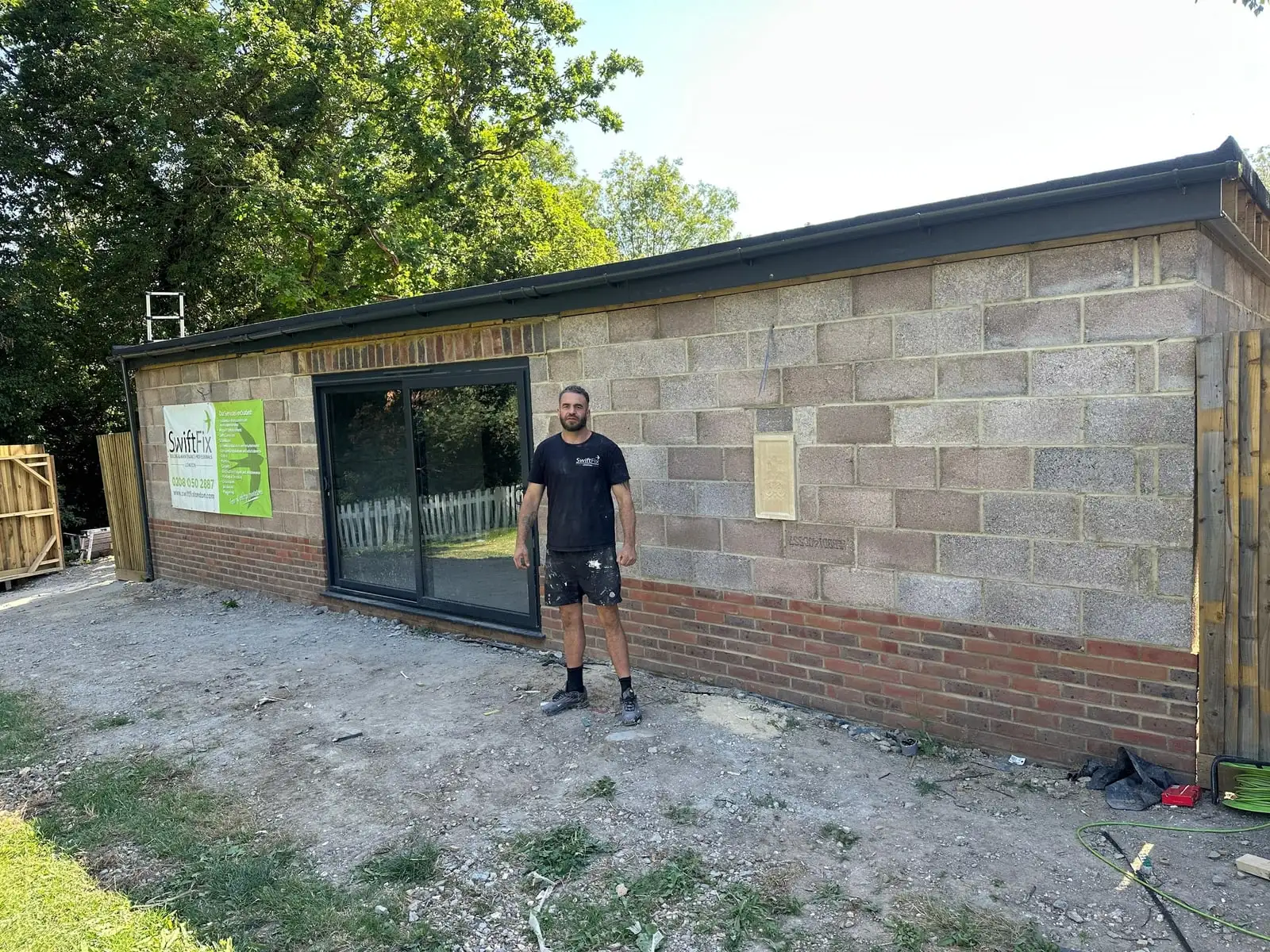Newly built blockwork garden gym with glazed sliding doors