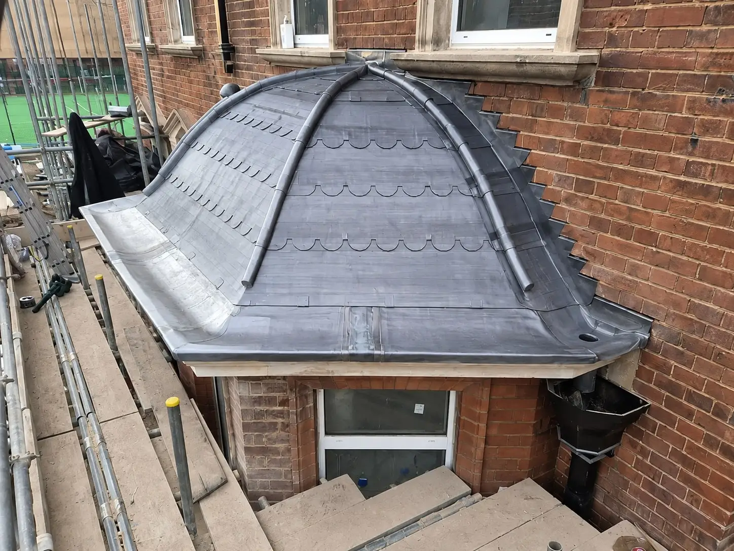 Close view of the hand-dressed lead rolls on the domed bay roof