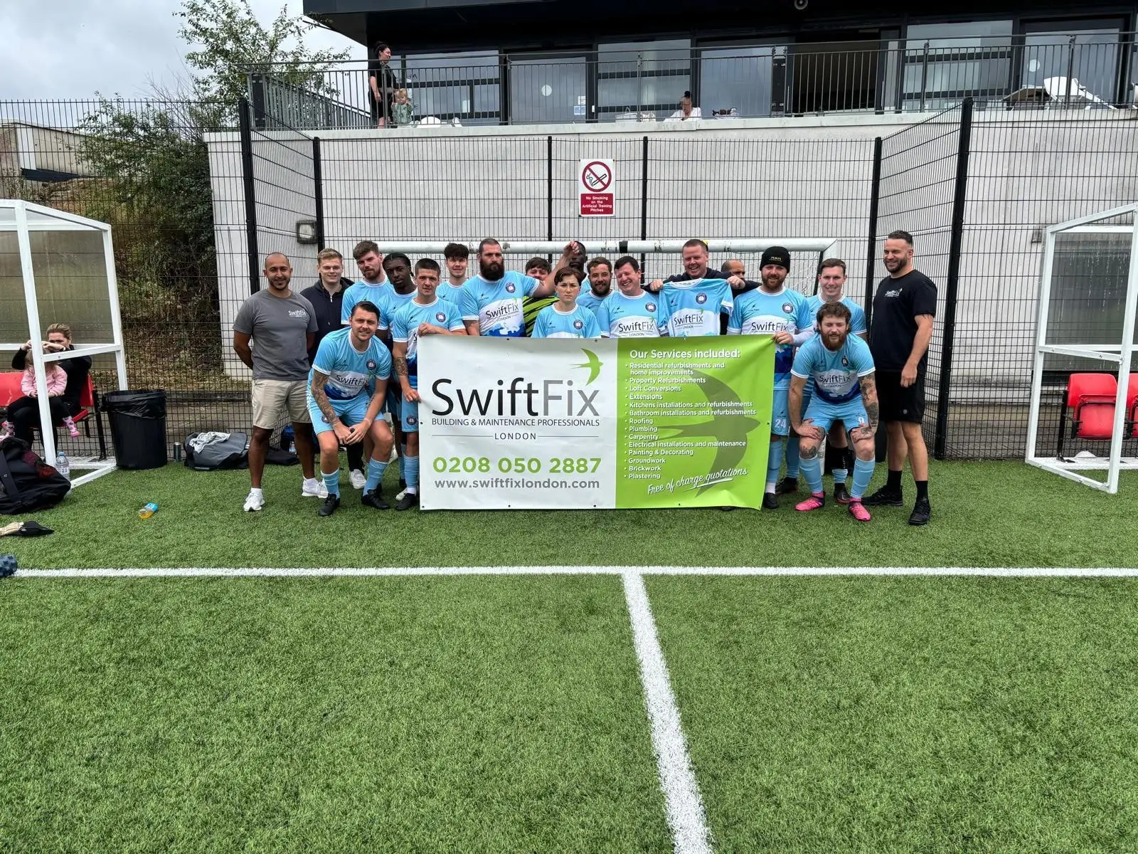 The Peoples FC squad holding the Swift Fix London banner on the pitch