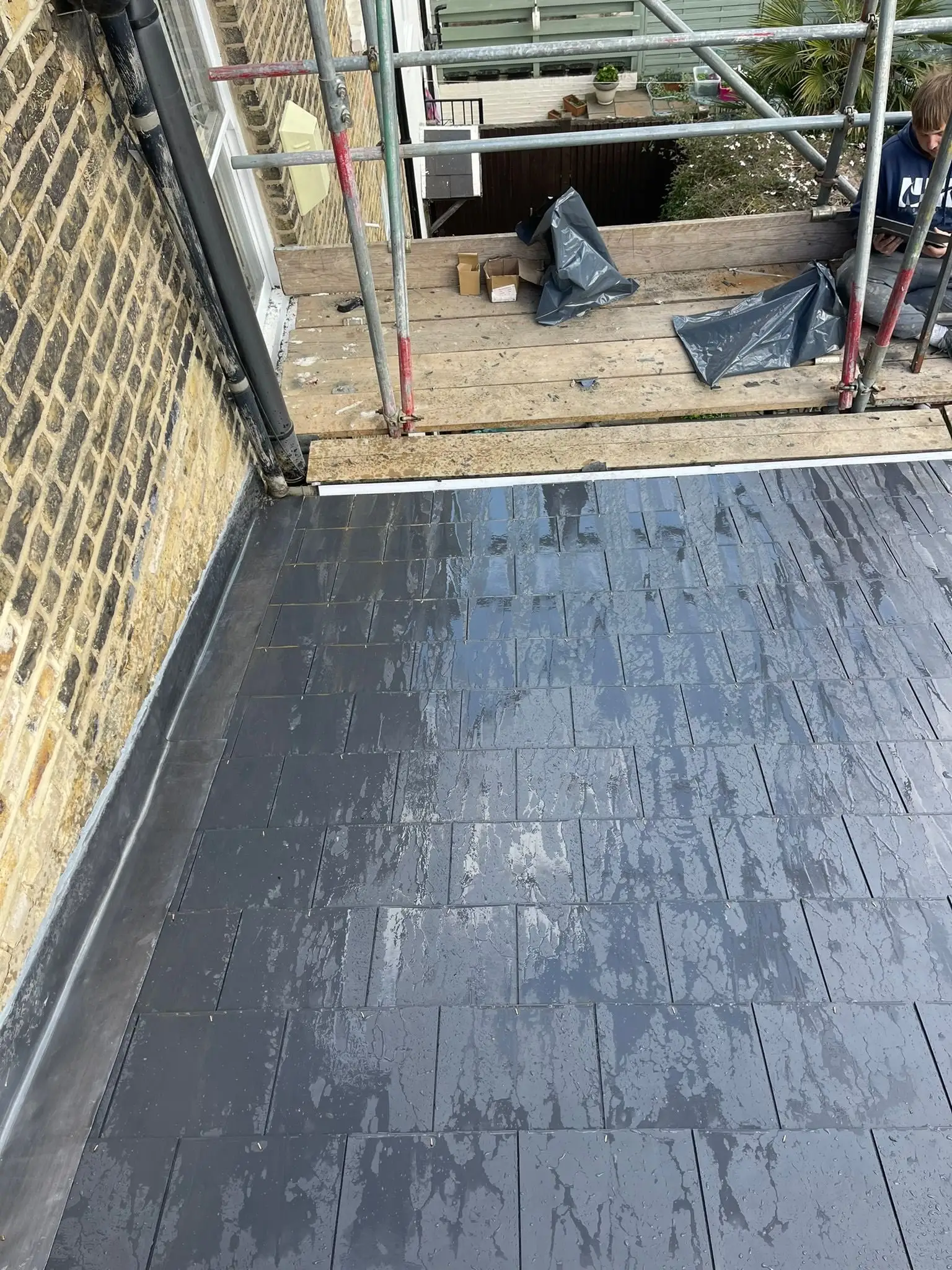 Rear slope of a London terrace re-covered in slate