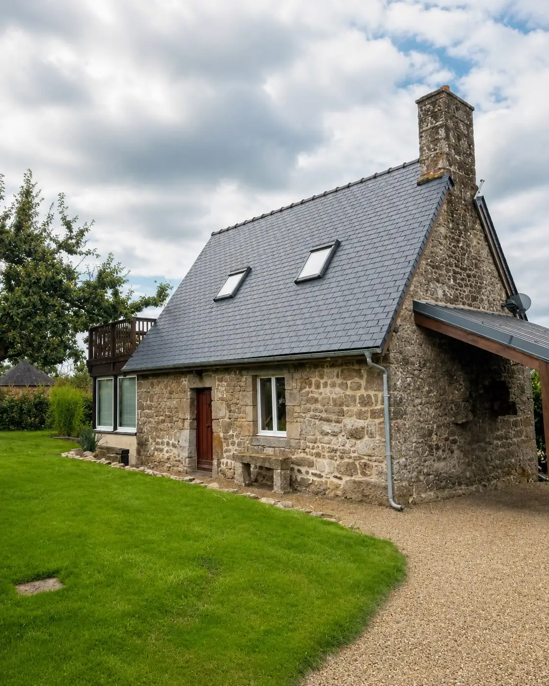 Stone cottage with a slate roof and rooflights