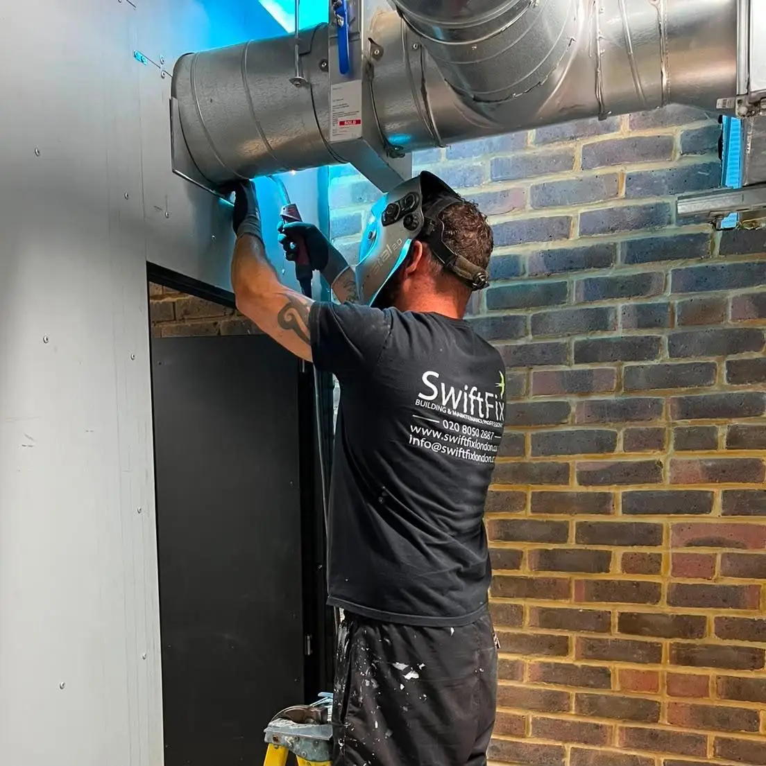 Swift Fix builder fitting ductwork to an external wall